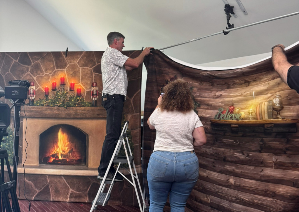 photographer setting up santa experience backdrops with TogDrop